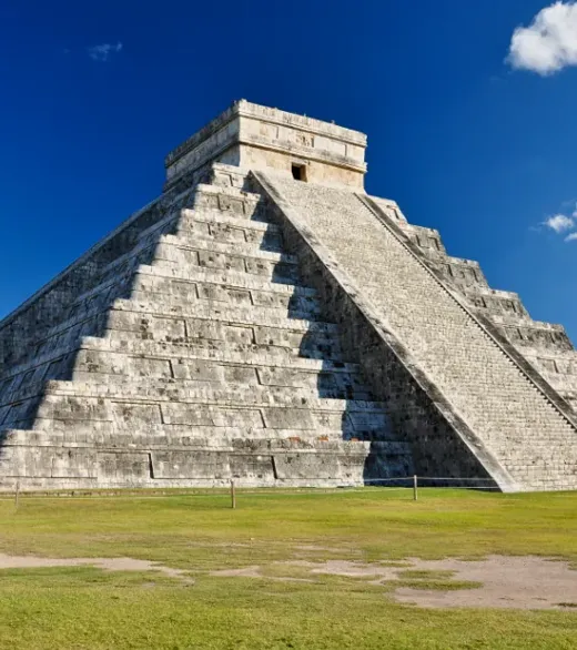 A stepped stone pyramid under a blue sky